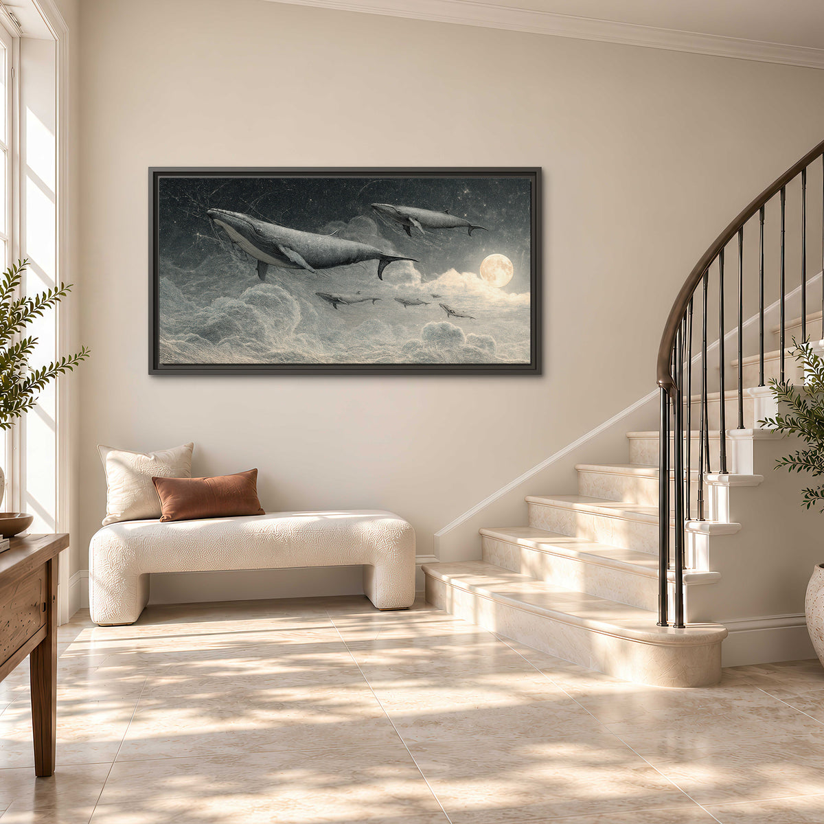 Monochrome whales floating over misty clouds beside a luminous painted moon single framed canvas wall art styled in an interior