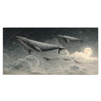 Monochrome whales floating over misty clouds beside a luminous painted moon single canvas wall art viewed straight on