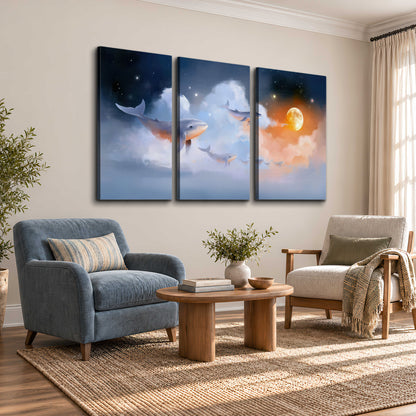 Blue whales gliding through pastel clouds beneath stars and a warm orange moon 3 piece canvas wall art styled in an interior