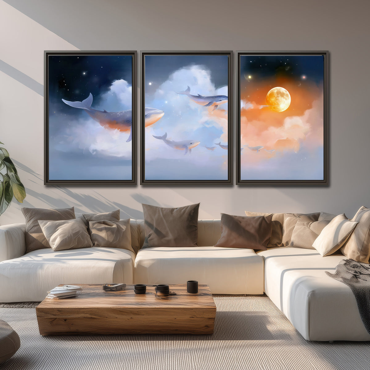 Blue whales gliding through pastel clouds beneath stars and a warm orange moon 3 piece framed canvas wall art displayed in a living room