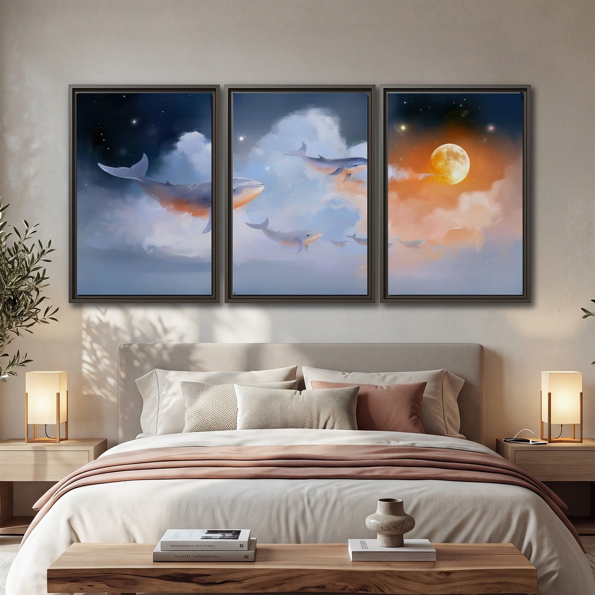 Blue whales gliding through pastel clouds beneath stars and a warm orange moon 3 piece framed canvas wall art displayed in a bedroom