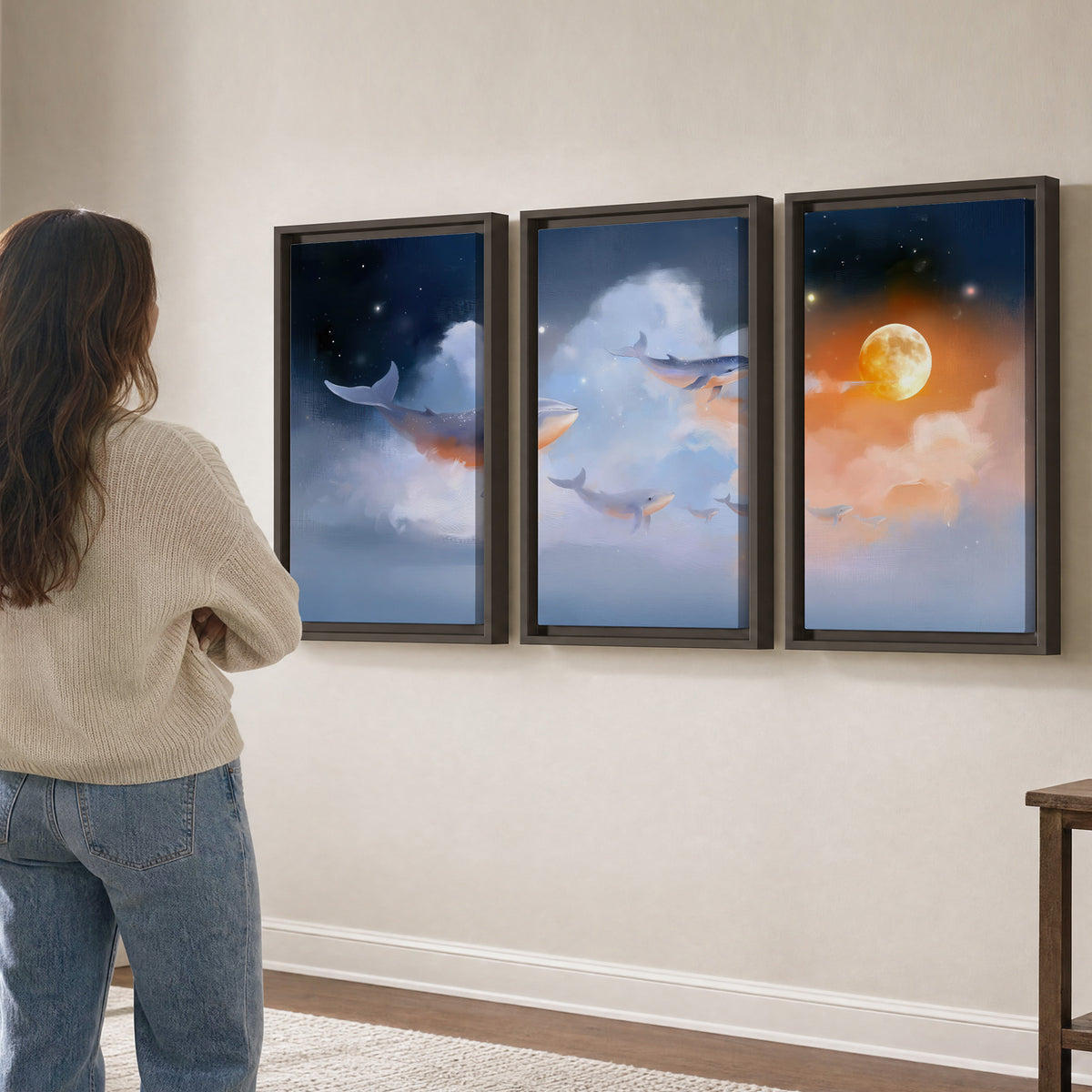 Blue whales gliding through pastel clouds beneath stars and a warm orange moon 3 piece framed canvas wall art three panel arrangement on a wall