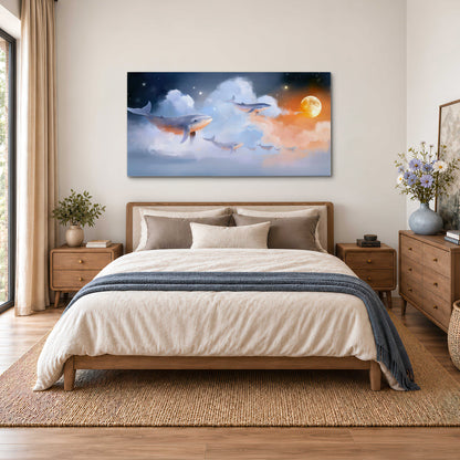 Blue whales gliding through pastel clouds beneath stars and a warm orange moon single canvas wall art styled in an interior