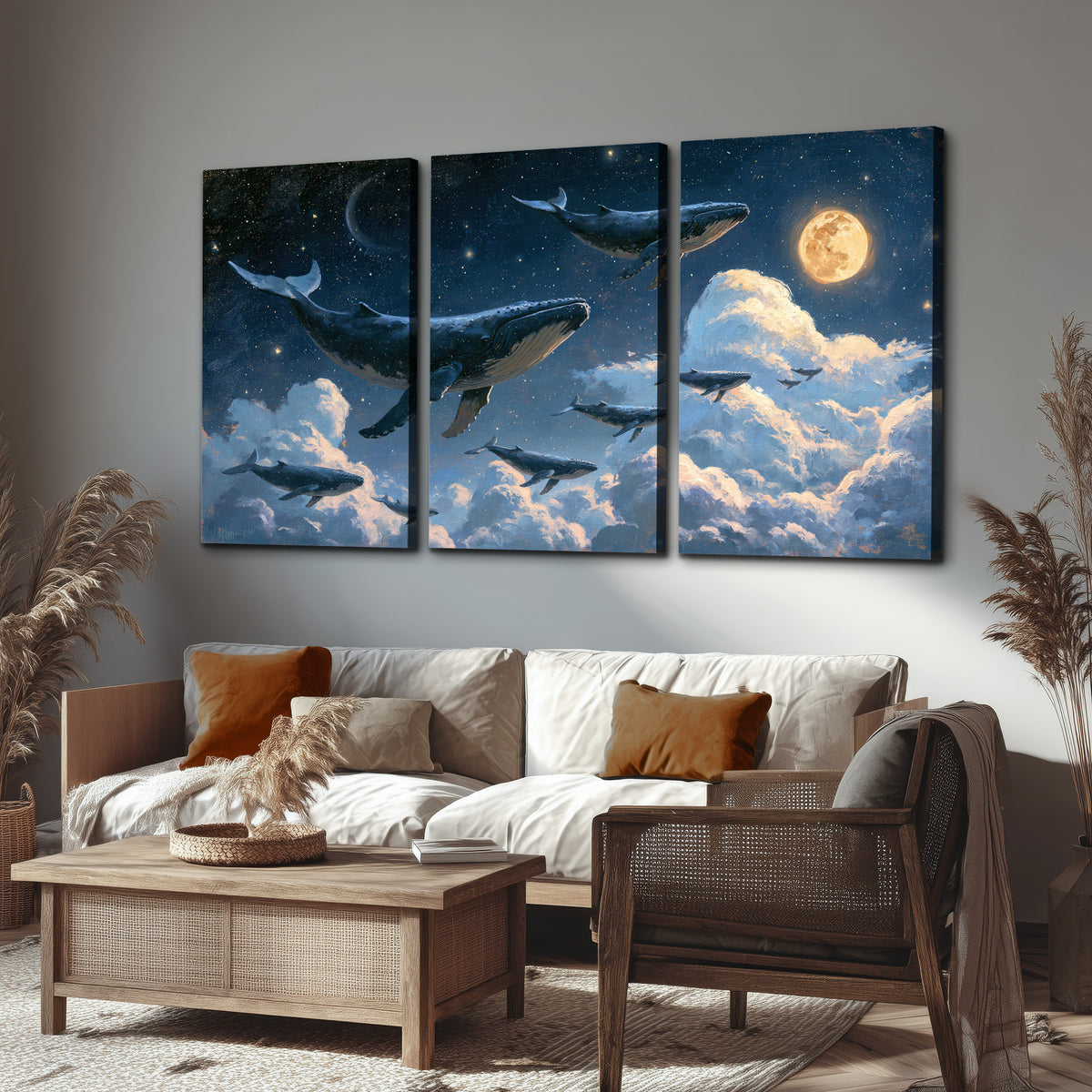 A group of whales floating among clouds beneath a golden moon in a deep blue night sky 3 piece canvas wall art displayed in a rustic living room