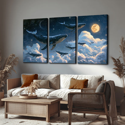 A group of whales floating among clouds beneath a golden moon in a deep blue night sky 3 piece canvas wall art displayed in a rustic living room