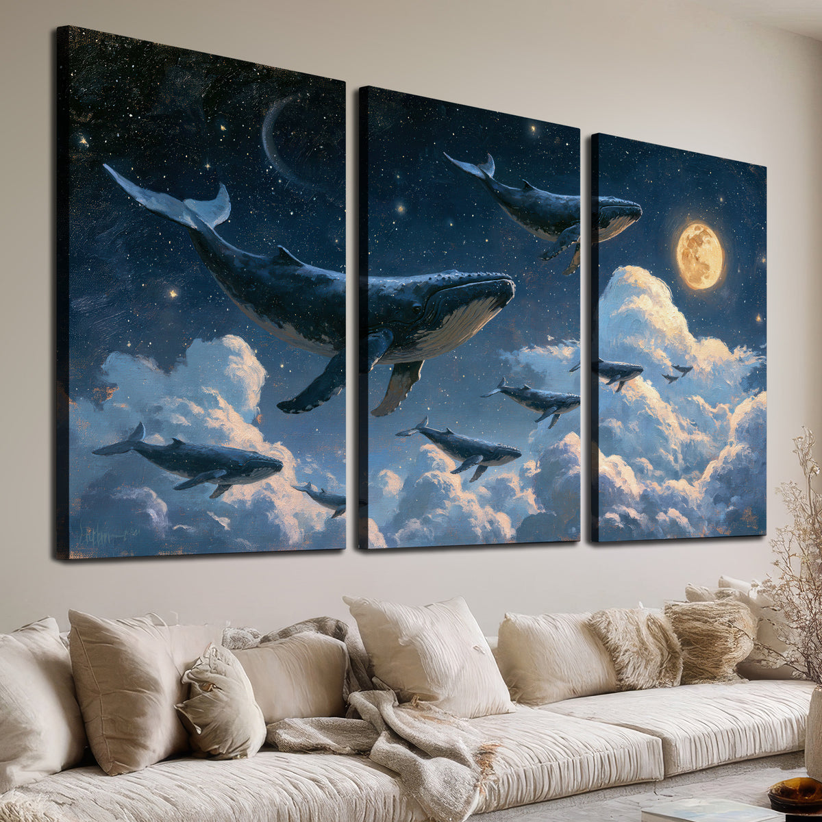A group of whales floating among clouds beneath a golden moon in a deep blue night sky 3 piece canvas wall art room and product view