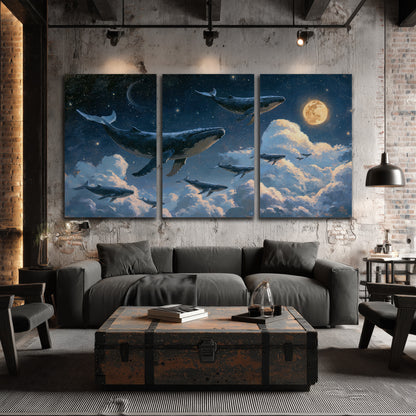A group of whales floating among clouds beneath a golden moon in a deep blue night sky 3 piece canvas wall art displayed in a industrial room