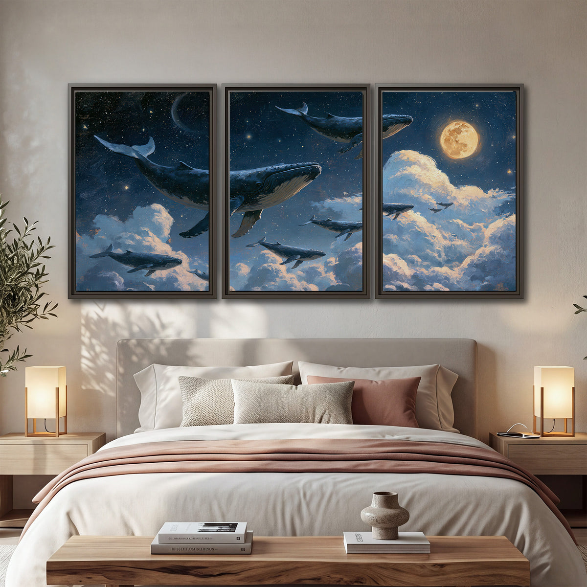 A group of whales floating among clouds beneath a golden moon in a deep blue night sky 3 piece framed canvas wall art displayed in a bedroom