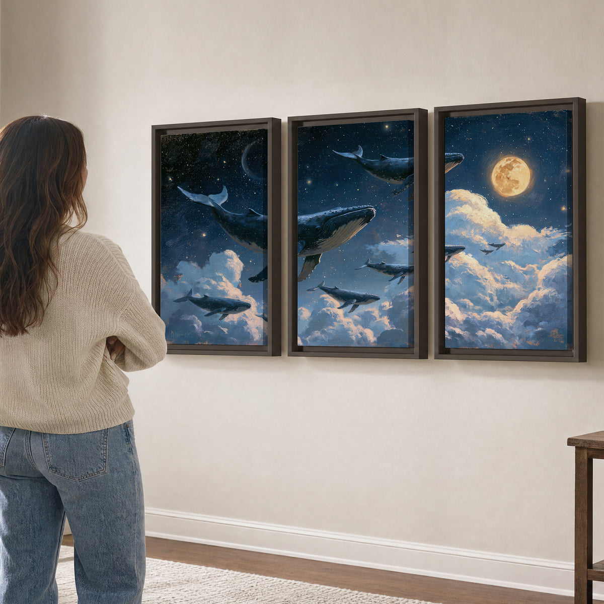 A group of whales floating among clouds beneath a golden moon in a deep blue night sky 3 piece framed canvas wall art three panel arrangement on a wall