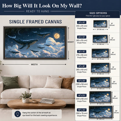 A group of whales floating among clouds beneath a golden moon in a deep blue night sky single framed canvas wall art size guide above a sofa; room view is illustrative