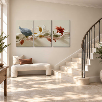 Ivory calla-like flowers and muted red accents curling across a cream background 3 piece canvas wall art styled in an interior
