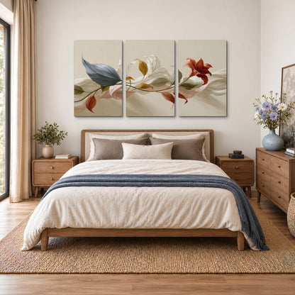 Ivory calla-like flowers and muted red accents curling across a cream background 3 piece canvas wall art styled in an interior