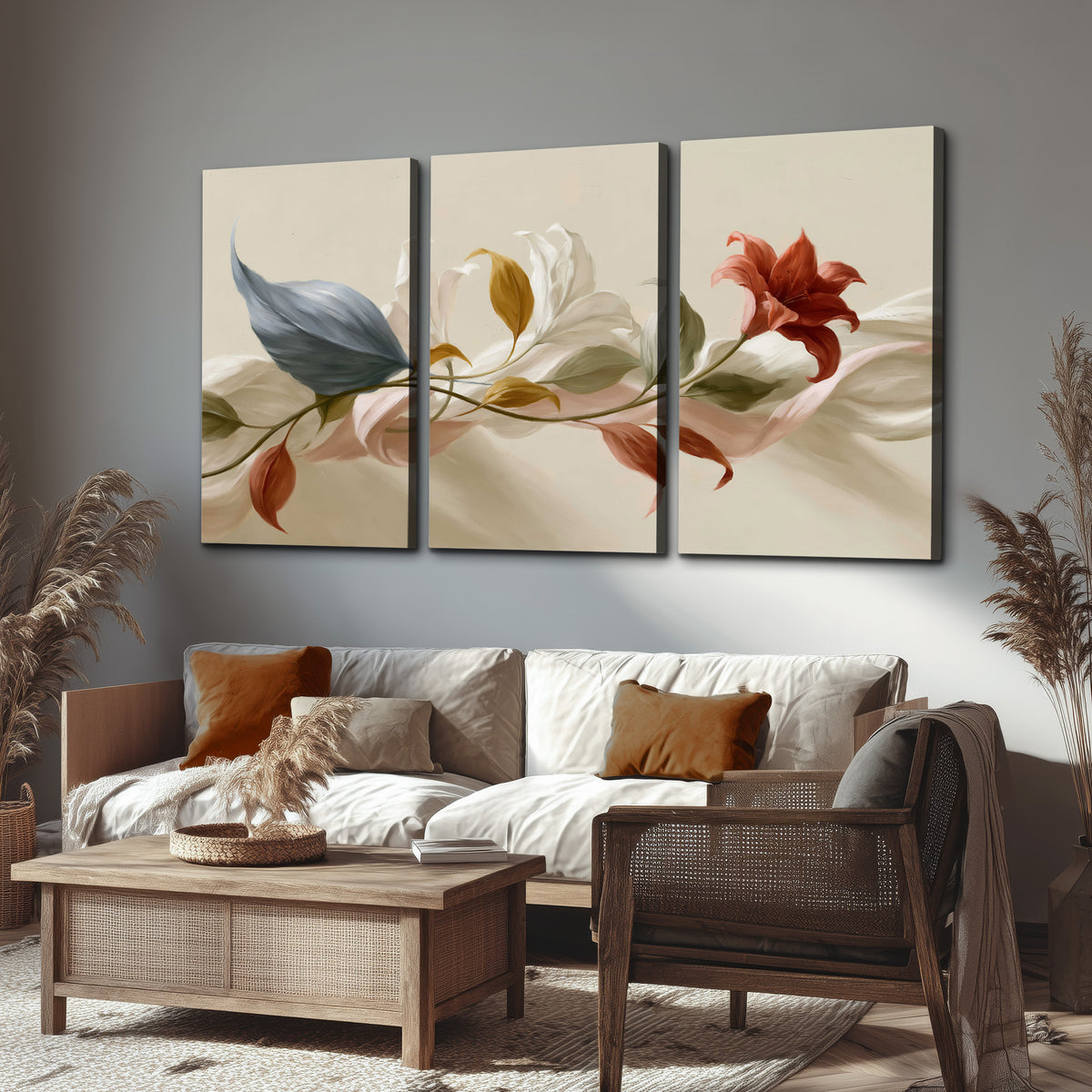 Ivory calla-like flowers and muted red accents curling across a cream background 3 piece canvas wall art displayed in a rustic living room