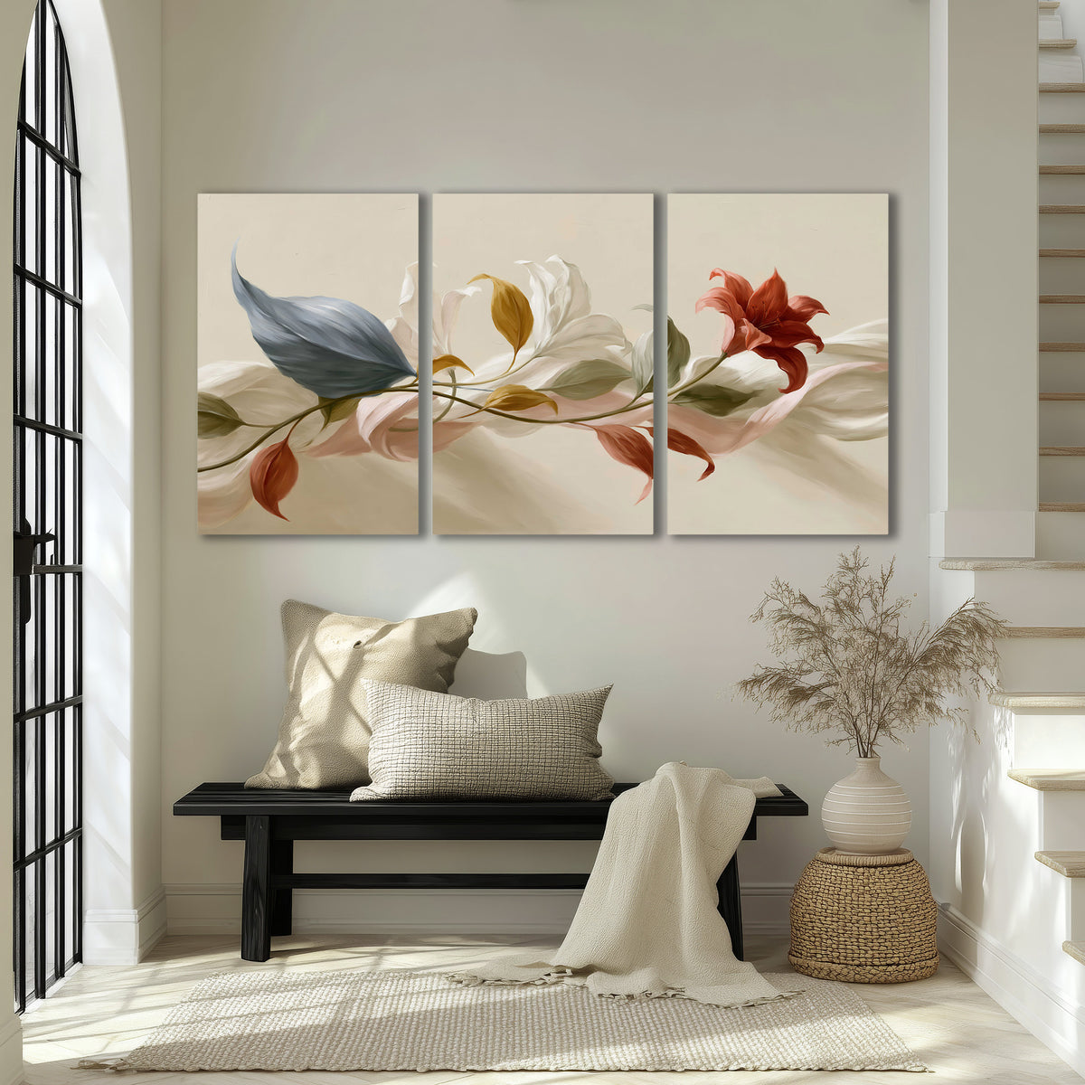 Ivory calla-like flowers and muted red accents curling across a cream background 3 piece canvas wall art displayed in a entryway