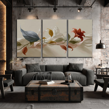 Ivory calla-like flowers and muted red accents curling across a cream background 3 piece canvas wall art displayed in a industrial room