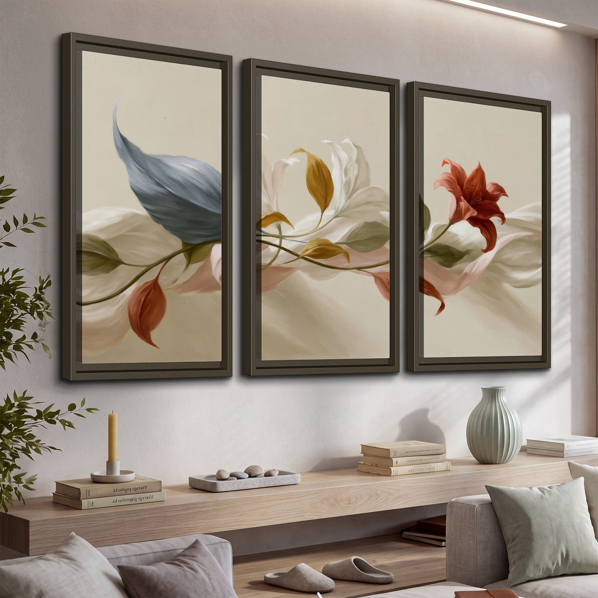 Ivory calla-like flowers and muted red accents curling across a cream background 3 piece framed canvas wall art displayed in a console