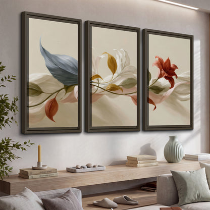 Ivory calla-like flowers and muted red accents curling across a cream background 3 piece framed canvas wall art displayed in a console