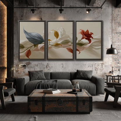 Ivory calla-like flowers and muted red accents curling across a cream background 3 piece framed canvas wall art displayed in a industrial room