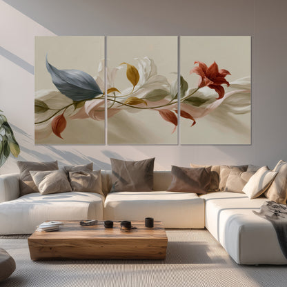 Ivory calla-like flowers and muted red accents curling across a cream background set of 3 poster prints displayed in a living room