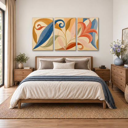 Bold blue, coral and golden leaf-like shapes flowing across a cream ground 3 piece canvas wall art styled in an interior