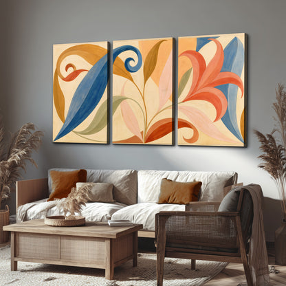 Bold blue, coral and golden leaf-like shapes flowing across a cream ground 3 piece canvas wall art displayed in a rustic living room