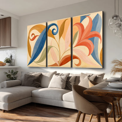 Bold blue, coral and golden leaf-like shapes flowing across a cream ground 3 piece canvas wall art room and product view