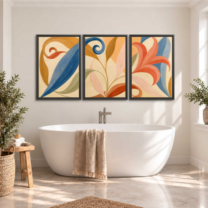Bold blue, coral and golden leaf-like shapes flowing across a cream ground 3 piece framed canvas wall art styled in an interior