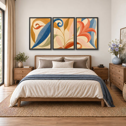 Bold blue, coral and golden leaf-like shapes flowing across a cream ground 3 piece framed canvas wall art styled in an interior