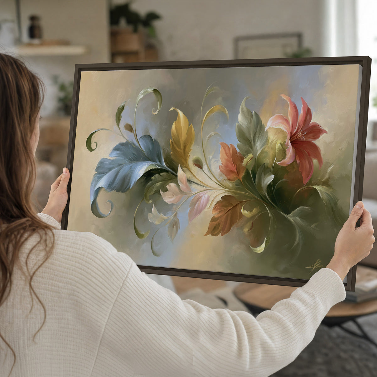 Curving blue, cream and warm red lily-like flowers on a softly shaded background single framed canvas wall art held in hands