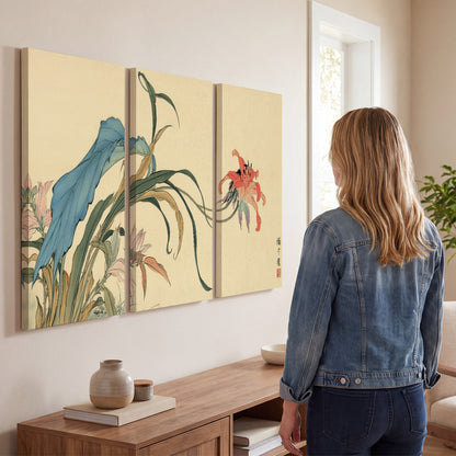 A delicate red flower and long blue-green leaves on a warm cream ground 3 piece canvas wall art three panel arrangement on a wall