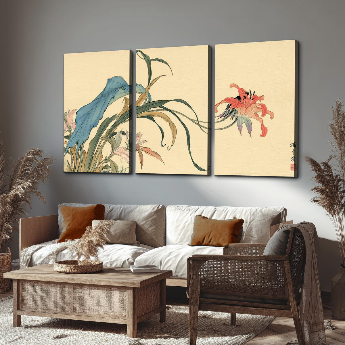 A delicate red flower and long blue-green leaves on a warm cream ground 3 piece canvas wall art displayed in a rustic living room