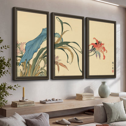 A delicate red flower and long blue-green leaves on a warm cream ground 3 piece framed canvas wall art displayed in a console