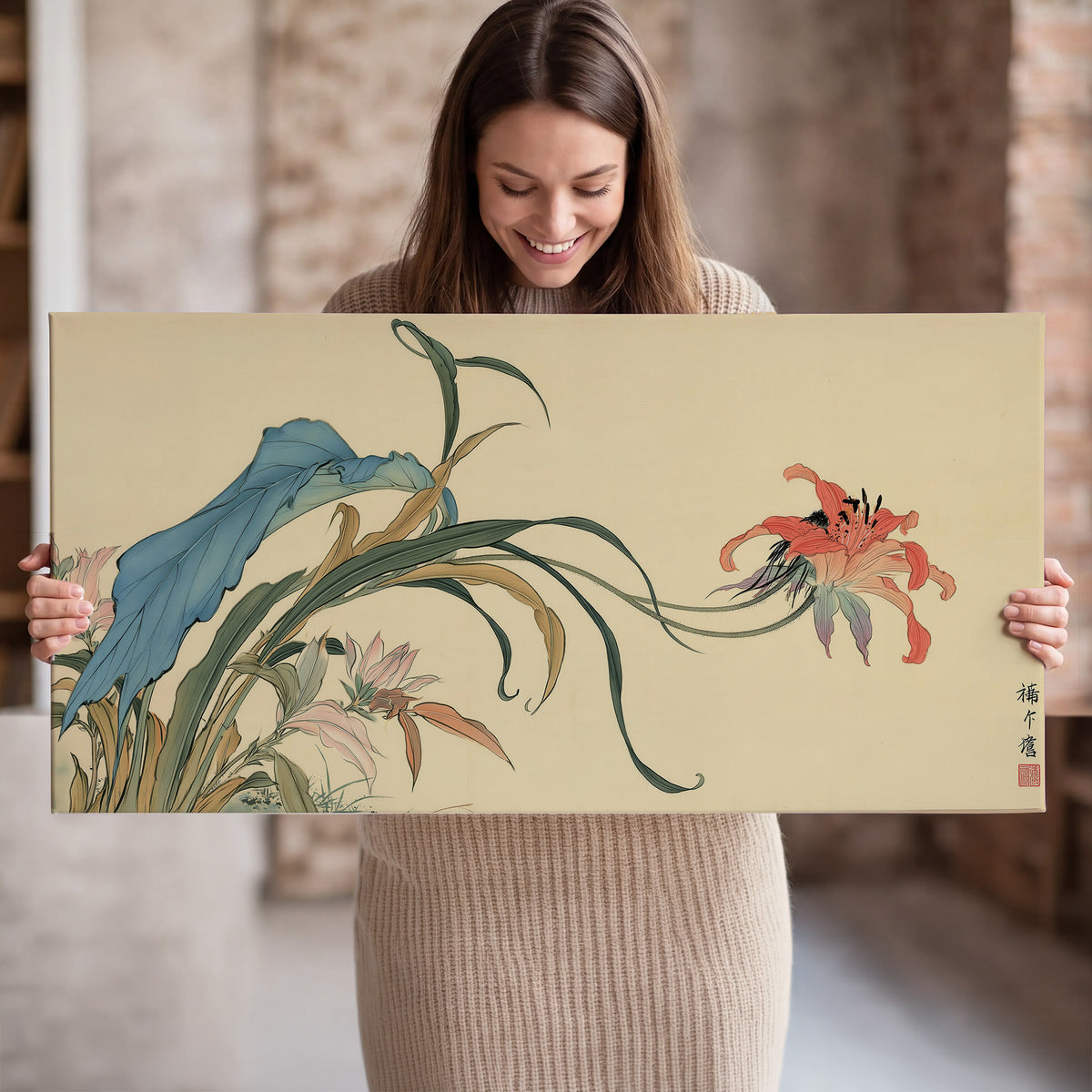 A delicate red flower and long blue-green leaves on a warm cream ground single canvas wall art held in hands
