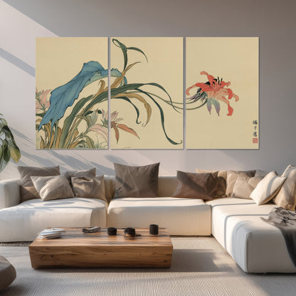 A delicate red flower and long blue-green leaves on a warm cream ground set of 3 poster prints displayed in a living room