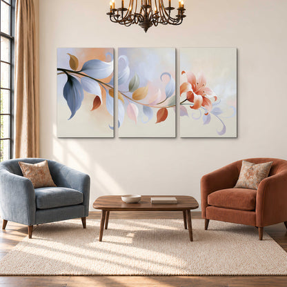 Peach blossoms and blue-green leaves in an airy cream-colored composition 3 piece canvas wall art styled in an interior