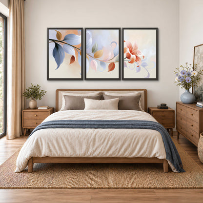 Peach blossoms and blue-green leaves in an airy cream-colored composition 3 piece framed canvas wall art styled in an interior