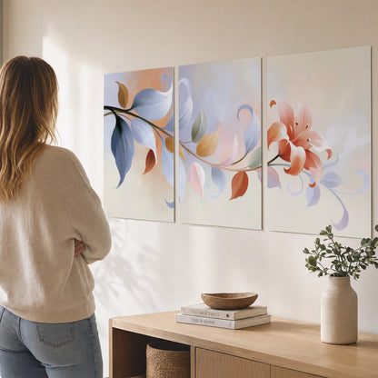 Peach blossoms and blue-green leaves in an airy cream-colored composition set of 3 poster prints three panel arrangement on a wall