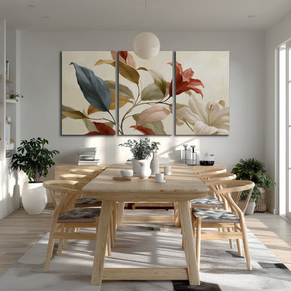 Cream flowers with broad blue and rust leaves sweeping across a neutral background 3 piece canvas wall art room and product view