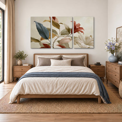 Cream flowers with broad blue and rust leaves sweeping across a neutral background 3 piece canvas wall art styled in an interior