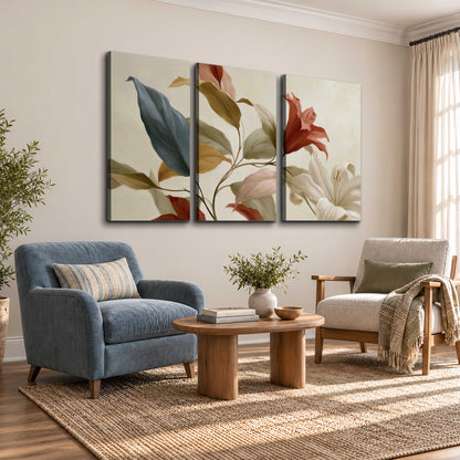 Cream flowers with broad blue and rust leaves sweeping across a neutral background 3 piece canvas wall art styled in an interior