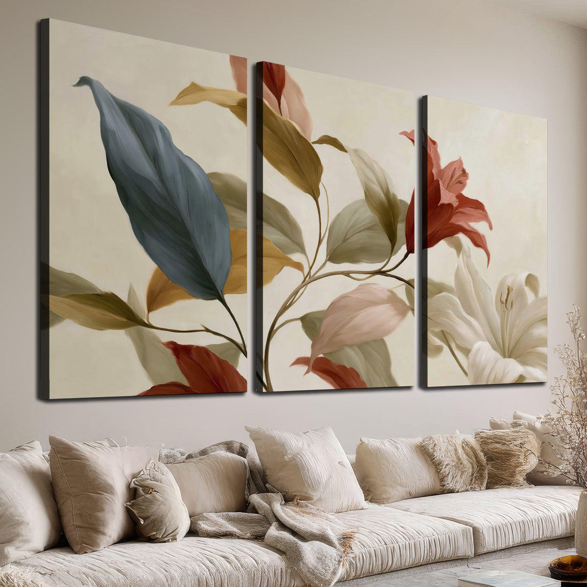 Cream flowers with broad blue and rust leaves sweeping across a neutral background 3 piece canvas wall art room and product view