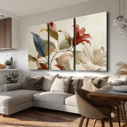 Cream flowers with broad blue and rust leaves sweeping across a neutral background 3 piece canvas wall art room and product view