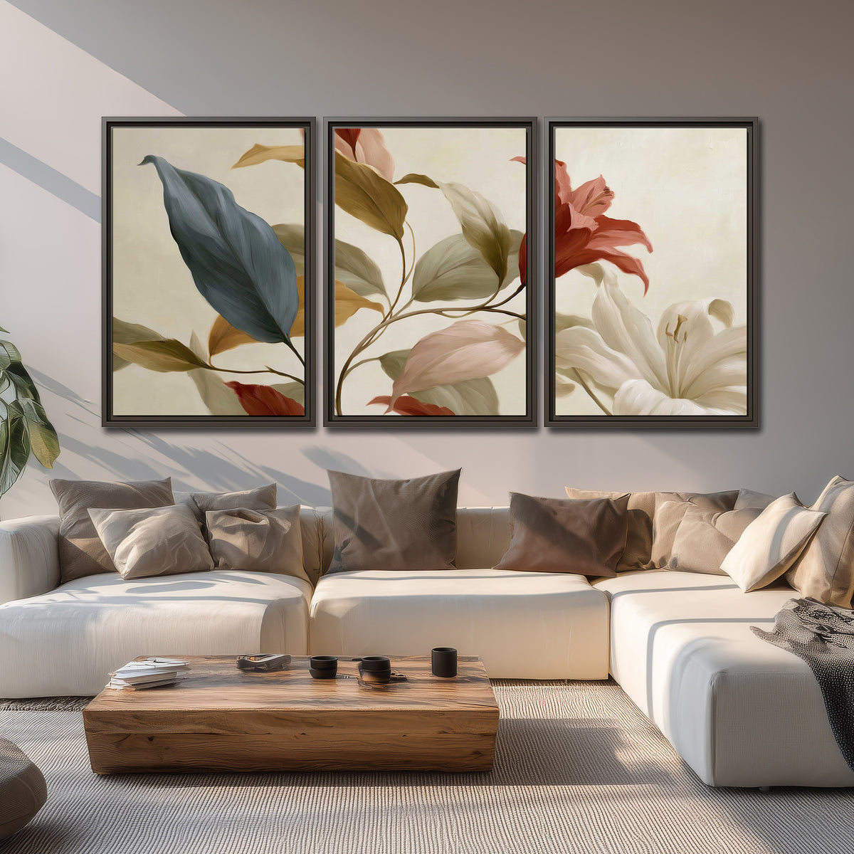 Cream flowers with broad blue and rust leaves sweeping across a neutral background 3 piece framed canvas wall art displayed in a living room