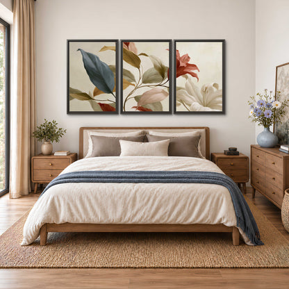 Cream flowers with broad blue and rust leaves sweeping across a neutral background 3 piece framed canvas wall art styled in an interior