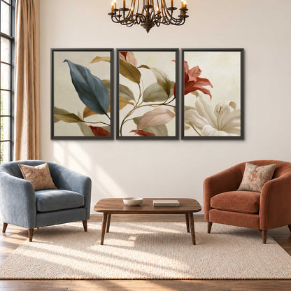 Cream flowers with broad blue and rust leaves sweeping across a neutral background 3 piece framed canvas wall art styled in an interior