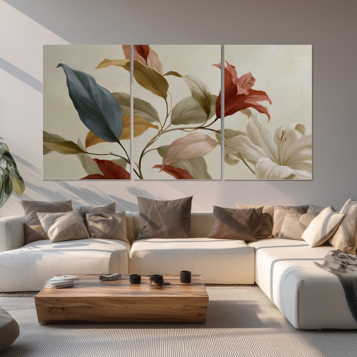 Cream flowers with broad blue and rust leaves sweeping across a neutral background set of 3 poster prints displayed in a living room
