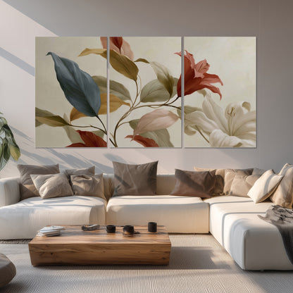 Cream flowers with broad blue and rust leaves sweeping across a neutral background set of 3 poster prints displayed in a living room