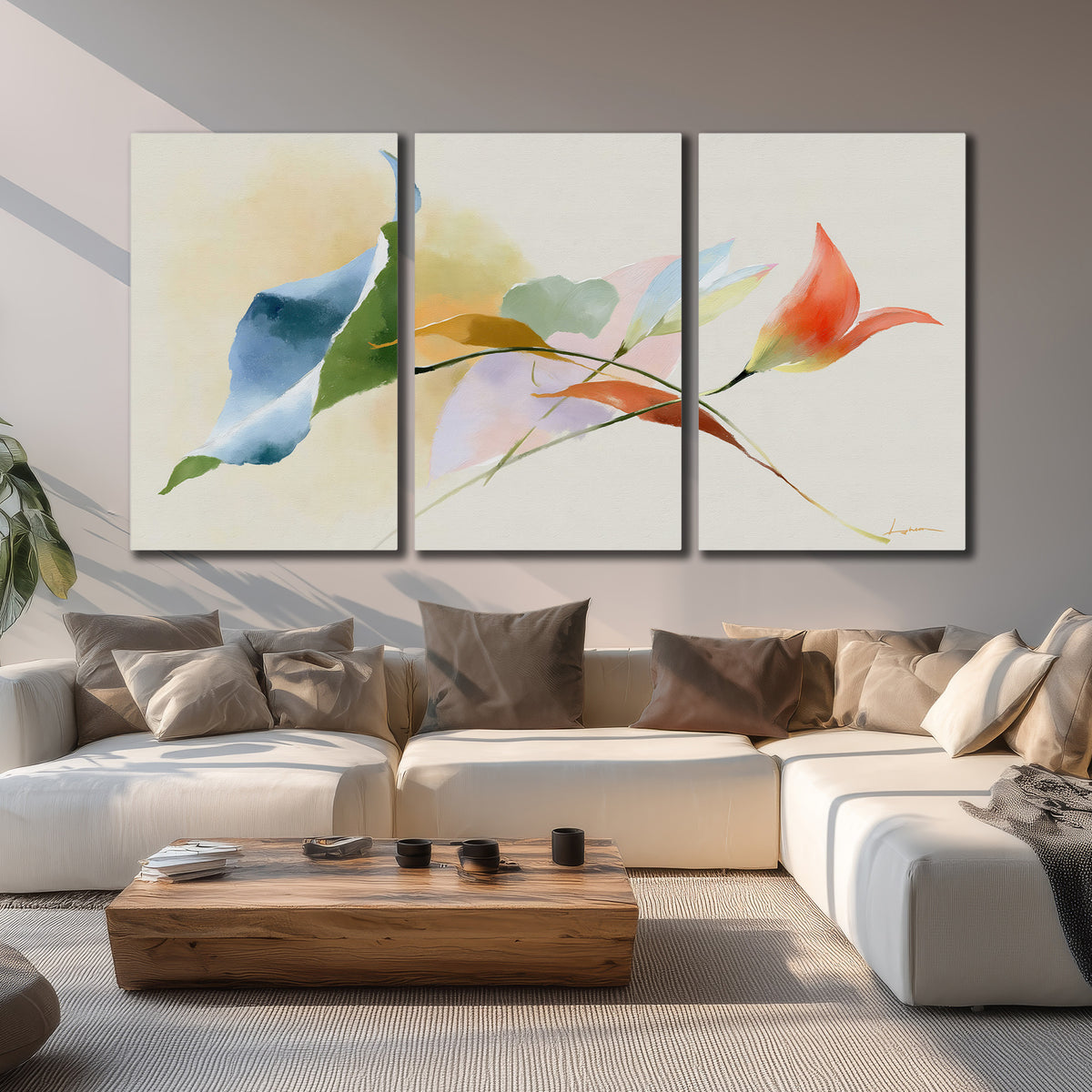 Airy green, orange and blue organic shapes floating across a white background 3 piece canvas wall art displayed in a living room
