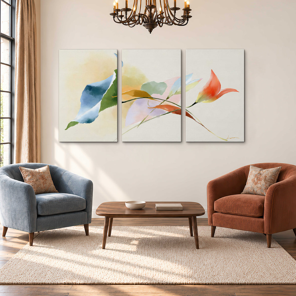 Airy green, orange and blue organic shapes floating across a white background 3 piece canvas wall art styled in an interior