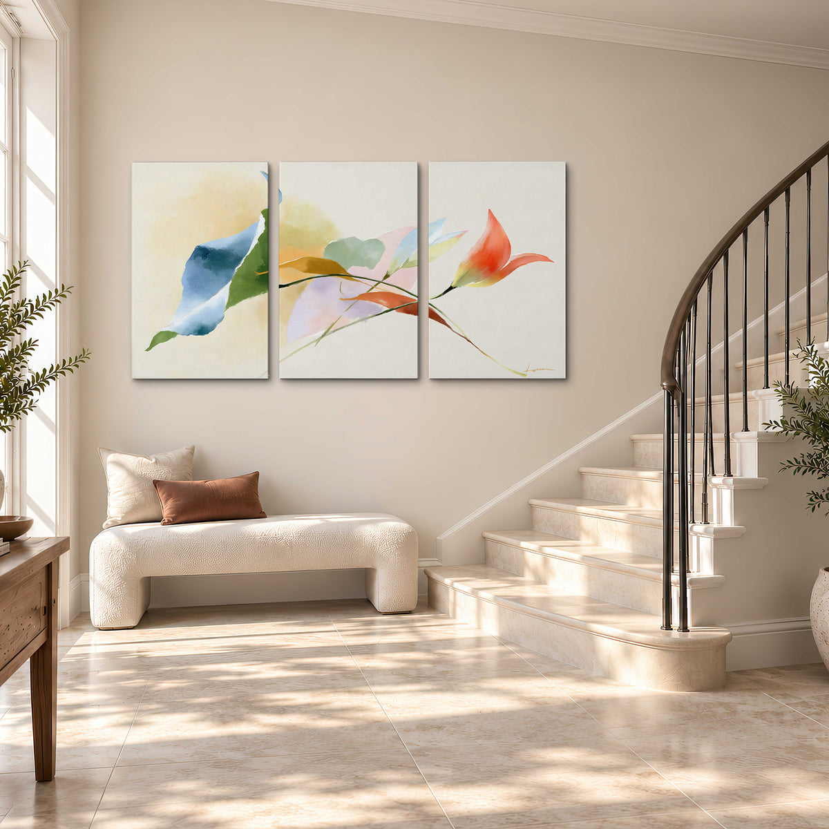 Airy green, orange and blue organic shapes floating across a white background 3 piece canvas wall art styled in an interior
